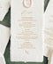 Handmade paper wedding menu with deckled edges, elegant typography, and wax seal detail, fine art reception stationery flat lay.
