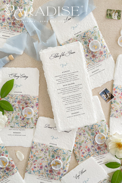 Add a touch of botanical beauty and fine art elegance to your event with our handmade paper wedding menus, crafted from 100% cotton rag paper with delicately torn deckled edges. Each menu features a vibrant floral vellum wrap paired with a soft silk ribbon and wax seal, creating an exquisite balance between organic texture and romantic detail. The minimalist typography allows the floral design to shine, making these menus perfect for garden weddings, spring celebrations and outdoor receptions.