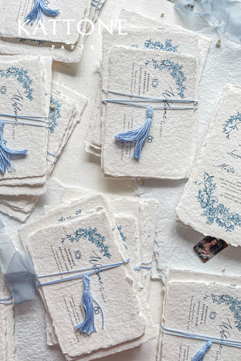 Embrace bohemian charm and natural elegance with the Juliette boho rustic stationery sets. Each handmade wedding invitation is a beautiful work of art, featuring luxurious cotton rag paper with a romantic deckle edge. To complete the bohemian feel, every suite is embellished with a delicate tassel, creating a uniquely personal and tactile experience for your guests. The combination of rustic textures and charming details makes this collection perfect for a relaxed and romantic celebration.