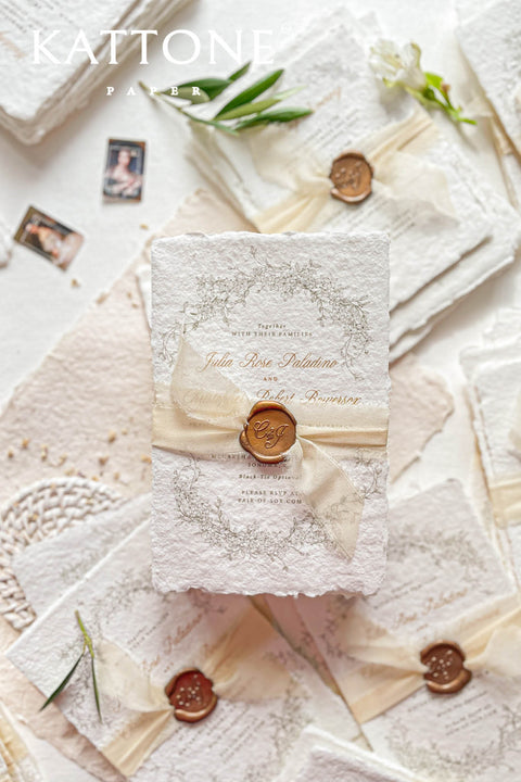 Elevate your special day with our stunning handmade Wedding Invitations, featuring exquisite paper with deckled edges for a touch of elegance. Each invitation is beautifully crafted and adorned with luxurious silk ribbon, making them a perfect choice for your unique celebration. Personalize your invitations to capture your love story, ensuring they set the perfect tone for your wedding.