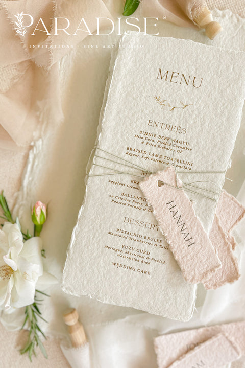 Add timeless charm and fine art elegance to your table styling with our handmade paper wedding menus, beautifully crafted from 100% cotton rag paper with naturally torn deckled edges. Each menu is adorned with a delicate name tag tied with fine thread, offering both practicality and sophistication as a combined menu and place card. The refined typography, minimal layout, and soft color palette bring a romantic yet modern touch, making these menus the perfect complement to luxury weddings, rehearsal dinners.