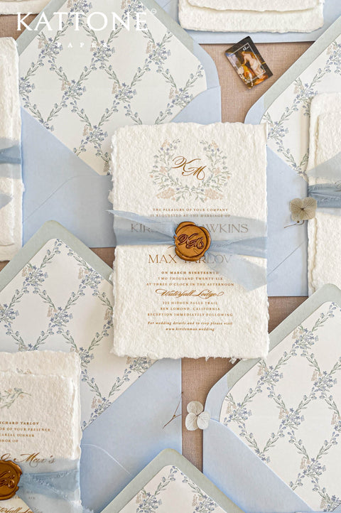 Handmade cotton paper wedding invitation highlighting thick deckled edges, rich organic texture and artisan paper craftsmanship.