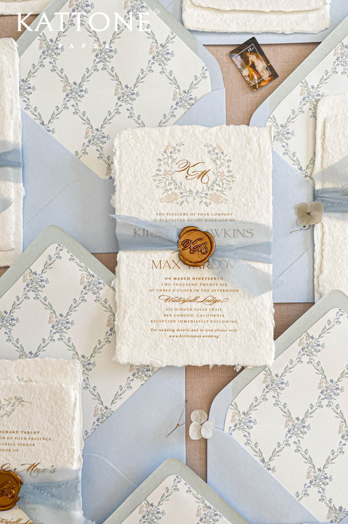 Handmade cotton paper wedding invitation highlighting thick deckled edges, rich organic texture and artisan paper craftsmanship.