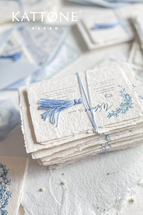 Embrace bohemian charm and natural elegance with the Juliette boho rustic stationery sets. Each handmade wedding invitation is a beautiful work of art, featuring luxurious cotton rag paper with a romantic deckle edge. To complete the bohemian feel, every suite is embellished with a delicate tassel, creating a uniquely personal and tactile experience for your guests. The combination of rustic textures and charming details makes this collection perfect for a relaxed and romantic celebration.