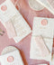 These handmade paper wedding menus capture the essence of romance and artisanal beauty. Crafted from 100% cotton rag paper, each menu features deckled edges, a luxurious tactile finish, and a timeless aesthetic that perfectly complements any elegant tablescape. The menus are adorned with a personalized wax seal and a custom name tag, adding a thoughtful, bespoke touch that enhances your guests’ dining experience.