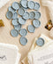 Soft, romantic, and timeless, these dusty blue wax seals add an elevated finishing touch to wedding invitations, envelopes, and fine-art stationery. Hand-poured and individually stamped, each seal features a smooth matte finish with subtle organic variation, making every piece beautifully unique. Perfect for classic, coastal, or modern wedding aesthetics, they pair effortlessly with handmade paper, vellum wraps, and silk ribbons.