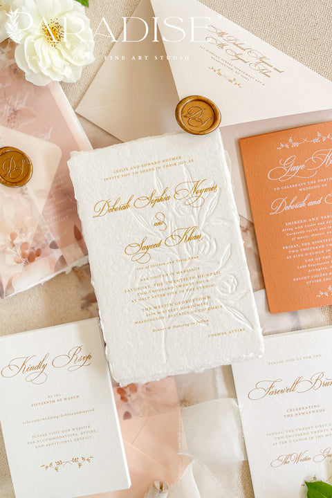 This exquisite wedding invites suite offers a blend of natural texture and romantic charm, perfect for an autumn wedding. Each piece is beautifully embossed with a delicate botanical design onto luxurious deckle edge cotton rag paper, providing a rich, tactile feel. The result is a truly romantic botanical wedding stationery set that captures the warm, earthy tones and intimate feel of the season.