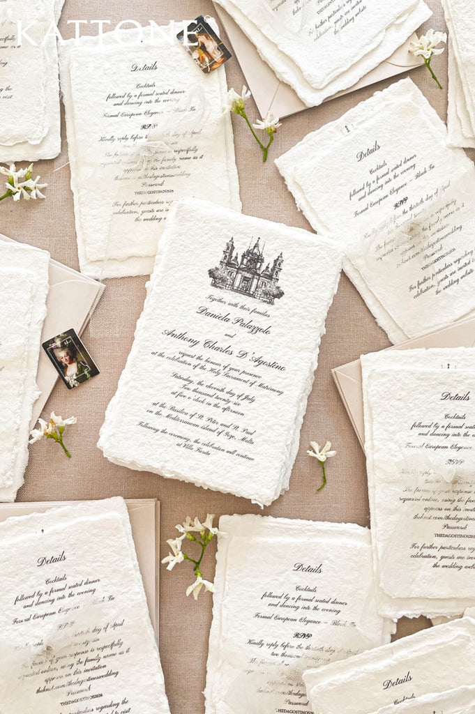 Fine art wedding invitation suite styled with handmade paper invitations, RSVP and details cards, envelopes and delicate floral accents.
