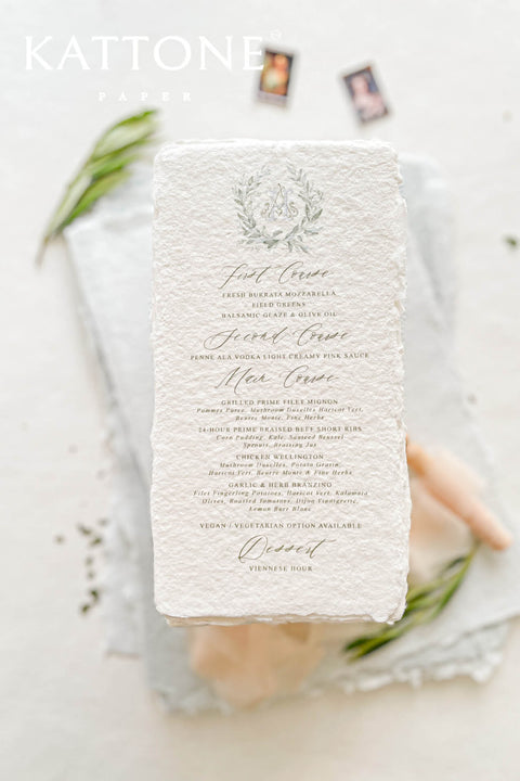 These handmade paper wedding menus capture the essence of timeless romance and artisanal elegance. Crafted from 100% cotton rag paper, each menu features naturally deckled edges and a rich, tactile texture that reflects the beauty of handcrafted design. The refined layout is elevated by a custom watercolor monogram framed in soft botanical details, bringing a delicate and personal touch to your wedding table.