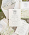 Luxury wedding invitation with vellum wrap featuring custom watercolor landscape printed on smooth cardstock.