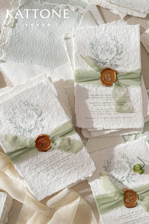 A refined baptism invitation crafted from luxurious handmade paper and finished with soft sage silk ribbon and a classic wax seal. Featuring a delicate watercolor botanical wreath and timeless typography, this design beautifully honors faith, tradition, and new beginnings. Perfect for baptisms and church ceremonies, it creates a meaningful first impression and a cherished keepsake for years to come.