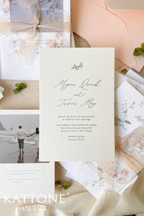 Announce your special day with an invitation suite that is a true work of art. These luxurious invites combine the tactile beauty of letterpress printing with a cherished photo of you as a couple, making for a deeply personal and memorable introduction to your wedding. The fine art quality of the suite is enhanced with beautiful calligraphy, creating a timeless and elegant feel. This is more than just stationery; it's a keepsake for your guests to treasure.
