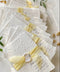 Announce your wedding with refined elegance through our embossed handmade paper Save the Date cards, crafted on luxury 100% cotton handmade paper with soft deckled edges. The embossed impression adds texture and sophistication, while each card is wrapped in a buttery yellow silk ribbon and sealed with a hand-pressed wax seal, creating a timeless and romantic presentation.