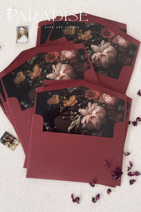 Burgundy wedding envelopes with printed guest addresses, crafted from premium paper and styled to showcase rich color, clean typography, and refined stationery quality.