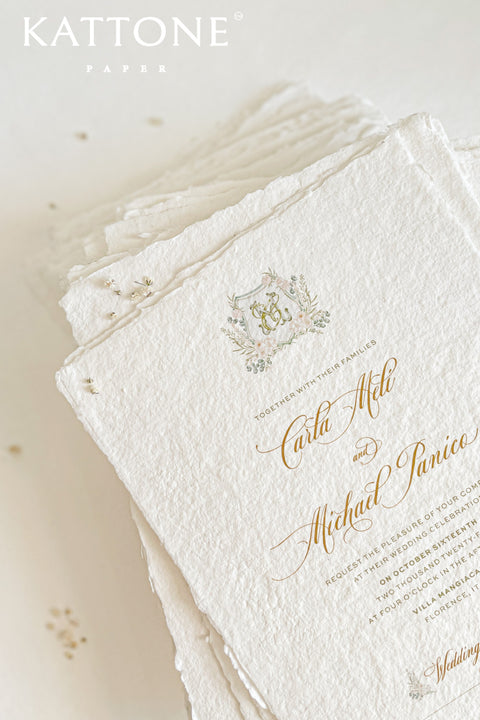 This exquisite trifold wedding invitation set offers a blend of modern design and personalized artistry. Each handmade paper invitation features a beautifully hand-painted custom watercolor monogram of your initials, creating a unique and personal touch. The convenient trifold design offers ample space for all your wedding details, all wrapped in a beautifully elegant package that your guests will adore.