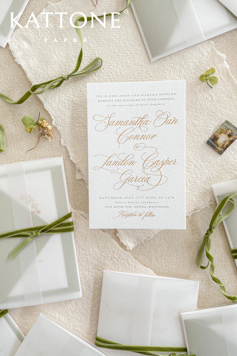 Elegant, timeless, and infused with personal charm - this wedding invitation suite was designed to announce your celebration with sophistication and warmth. Printed on luxury cotton paper. The suite features a beautifully hand-drawn monogram, symbolizing the union of two names in an artful botanical wreath. A romantic script font paired with refined serif text brings balance and grace, while vellum jackets and olive ribbons add layers of soft, organic beauty.