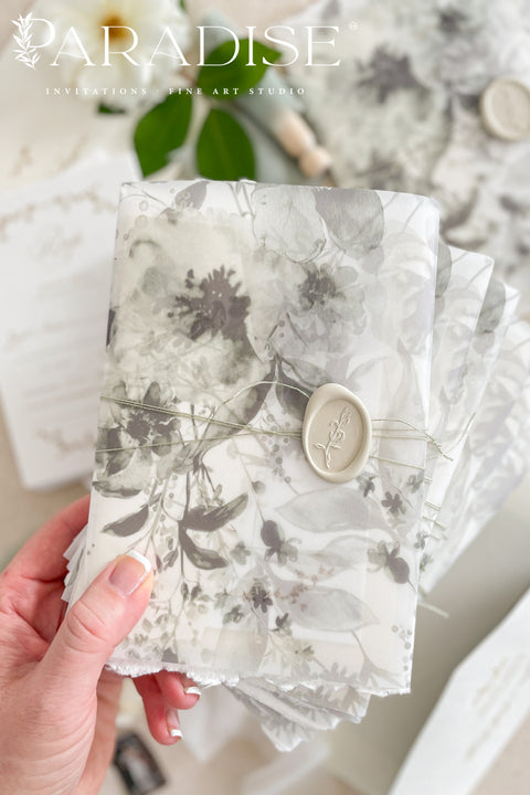 Our handmade wedding invitation suite features a custom hand-drawn monogram, printed on luxury deckled-edge cotton paper, and wrapped in translucent vellum jackets adorned with fine art floral illustrations. Each suite is finished with a silk ribbon and wax seal, blending old-world romance with modern artistry. Designed for couples who cherish attention to detail, this suite embodies elegance and craftsmanship - perfect for fine art, garden, or destination weddings.
