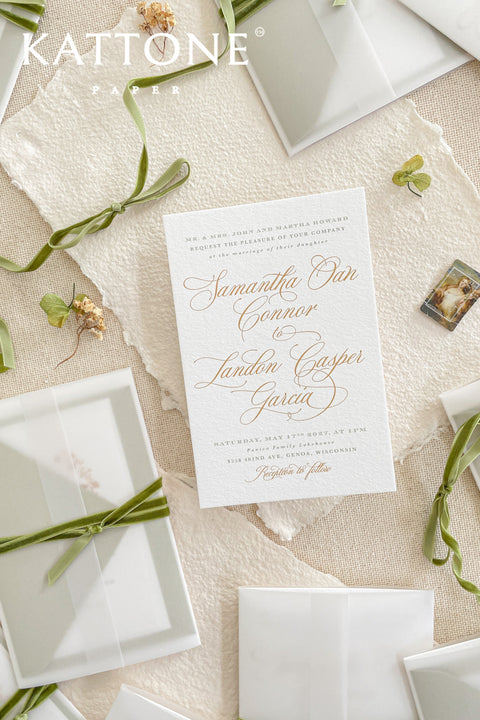 Elegant, timeless, and infused with personal charm - this wedding invitation suite was designed to announce your celebration with sophistication and warmth. Printed on luxury cotton paper. The suite features a beautifully hand-drawn monogram, symbolizing the union of two names in an artful botanical wreath. A romantic script font paired with refined serif text brings balance and grace, while vellum jackets and olive ribbons add layers of soft, organic beauty.