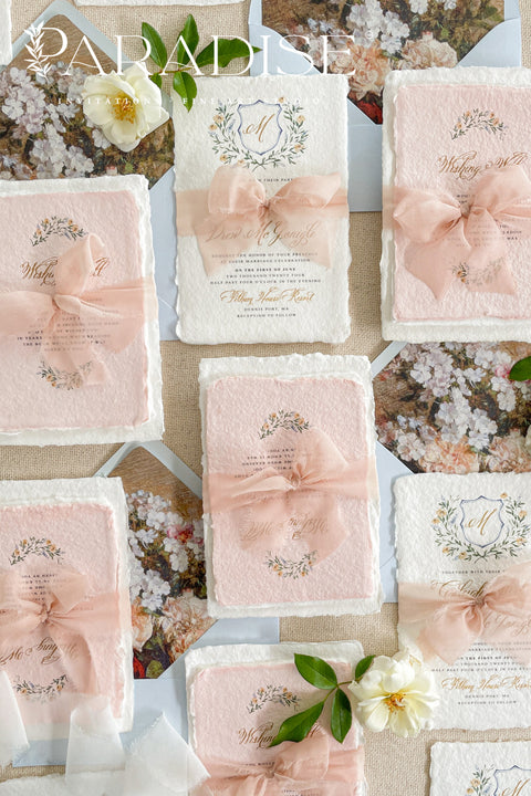 Announce your love story with timeless artistry through our handmade watercolor floral crest wedding invitations, where classic design meets modern elegance. Each invitation is crafted by hand and features a beautifully painted watercolor crest of delicate florals, personalized with your initials - a true symbol of your union.