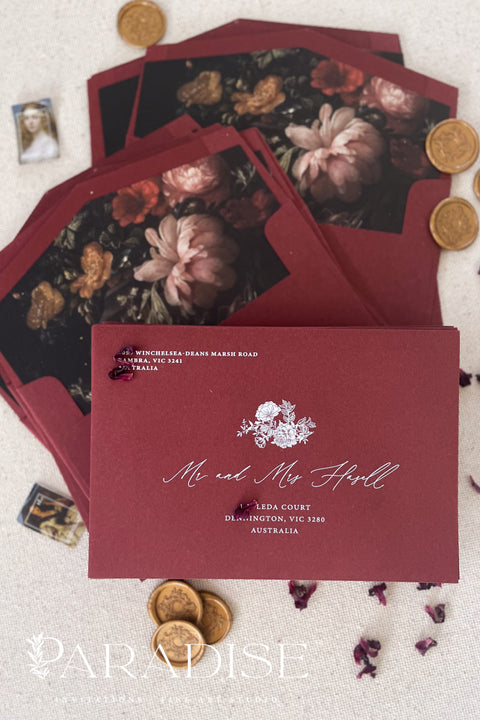 Burgundy wedding envelopes with printed guest addresses, crafted from premium paper and styled to showcase rich color, clean typography, and refined stationery quality.