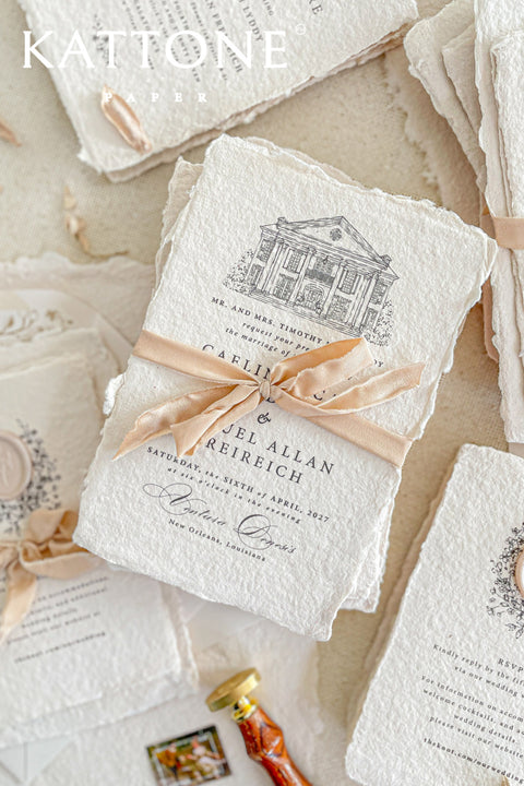 Invite your guests to your special day with the artful and personal charm of these custom wedding invitations. The unique suite features a beautiful, custom venue illustration sketch, hand-drawn by us to capture the essence of your wedding location. Designed with a light summer breeze theme and a boho chic aesthetic, this wedding stationery sets a warm, relaxed, and intimate tone for your upcoming celebration.