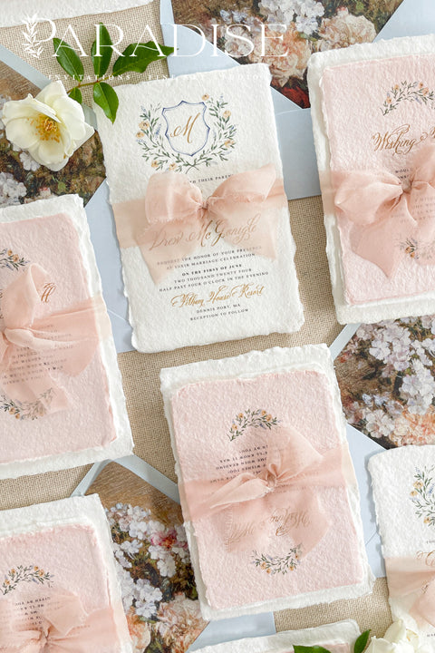 Announce your love story with timeless artistry through our handmade watercolor floral crest wedding invitations, where classic design meets modern elegance. Each invitation is crafted by hand and features a beautifully painted watercolor crest of delicate florals, personalized with your initials - a true symbol of your union.