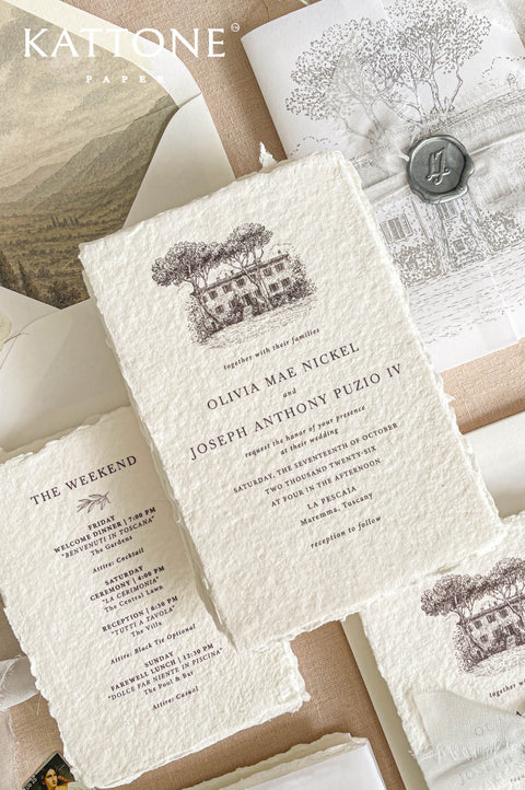Premium handmade wedding invitation suite with custom architectural venue artwork, vellum wraps, deckled edge cotton paper, wax seal accents, and neutral countryside-inspired styling.