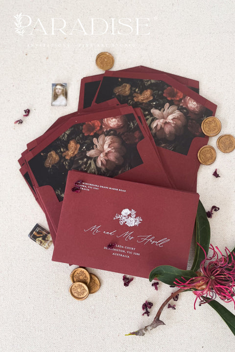 Burgundy wedding envelopes with printed guest addresses, crafted from premium paper and styled to showcase rich color, clean typography, and refined stationery quality.