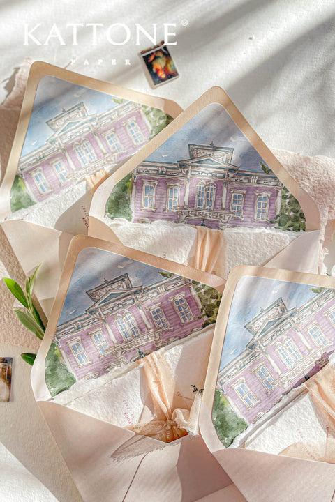Close-up of watercolor venue illustration printed on envelope liner, showing architectural details, soft washes, and refined texture.
