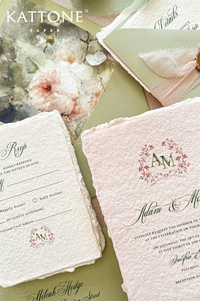 Custom floral crest monogram printed in blush and sage tones adds a meaningful personalized touch to this luxury wedding suite.