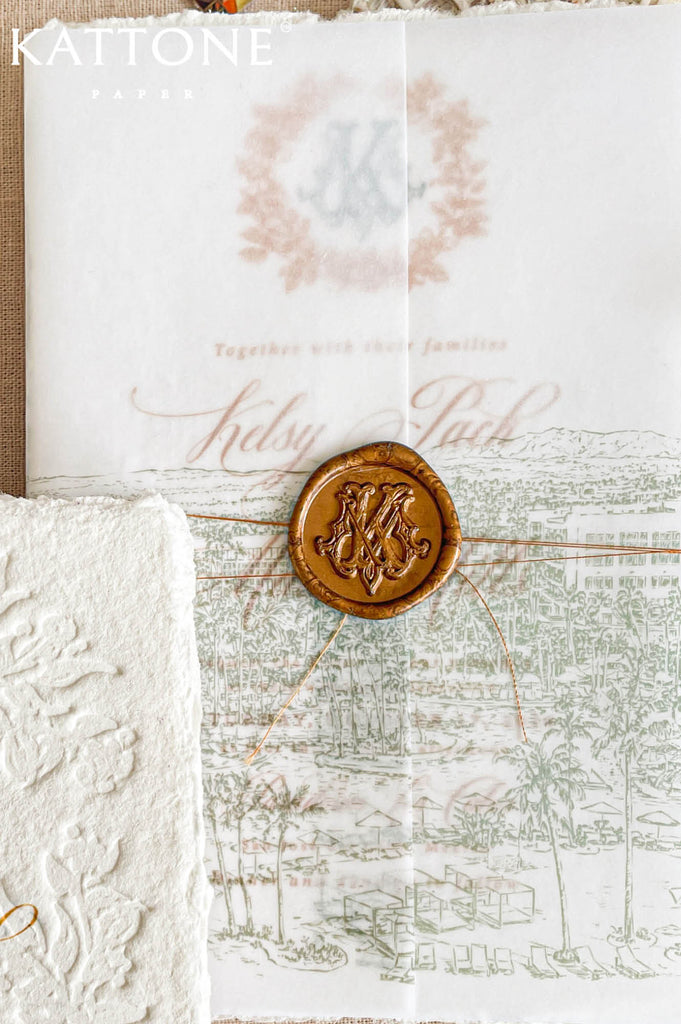 Soft translucent vellum wedding invitation cover layered over handmade cotton paper and finished with a wax seal for a refined and romantic presentation.