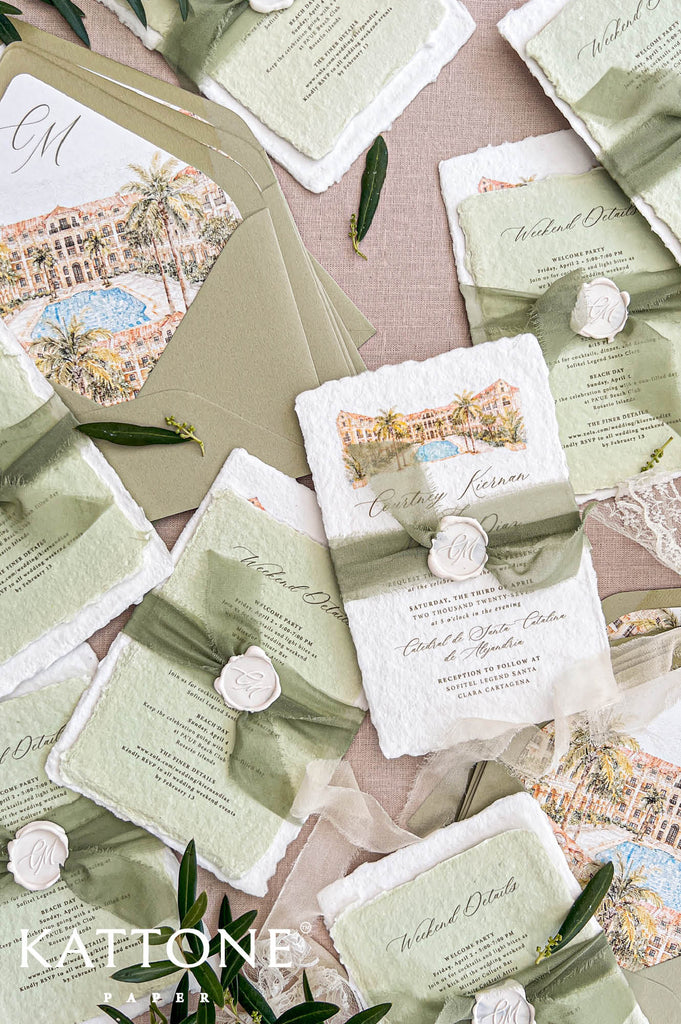 Overhead arrangement of sage green wedding invitations and matching handmade paper details cards, featuring watercolor resort architecture, palm trees, a blue pool, personalized wax seals, soft olive silk ribbons, and illustrated wedding envelope liners.