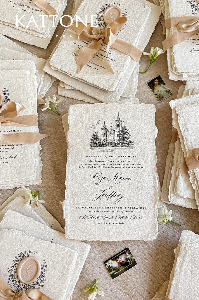 Handmade paper RSVP card with floral wreath illustration and elegant script typography.