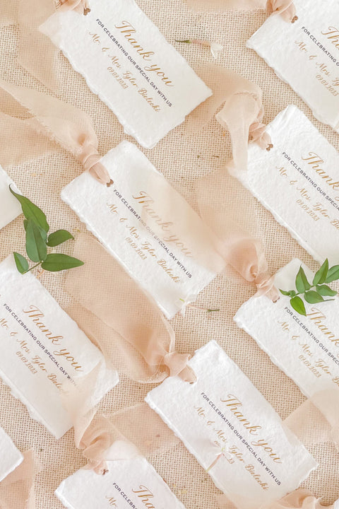 A beautifully handcrafted thank you card made from luxurious handmade paper, designed to express gratitude with timeless elegance. Featuring soft deckled edges, refined calligraphy-style typography, and an airy chiffon ribbon accent, these cards add a thoughtful, personal touch to weddings, events, and special occasions. Perfect for couples who appreciate fine-art stationery and meaningful details.