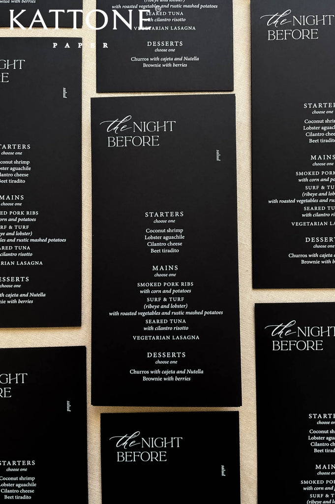 Rehearsal dinner table stationery featuring black wedding menus and modern minimalist design.