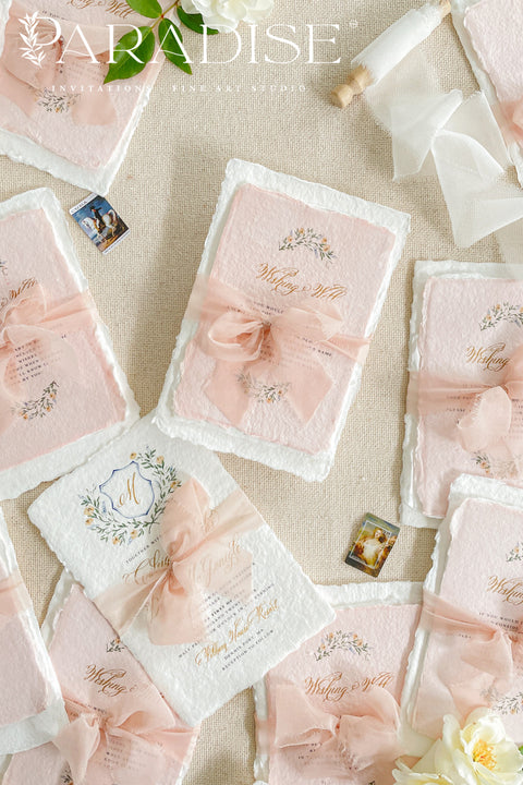 Announce your love story with timeless artistry through our handmade watercolor floral crest wedding invitations, where classic design meets modern elegance. Each invitation is crafted by hand and features a beautifully painted watercolor crest of delicate florals, personalized with your initials - a true symbol of your union.