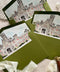Luxury olive green wedding envelopes with custom venue illustration liners featuring a historic stone estate in soft watercolor tones.