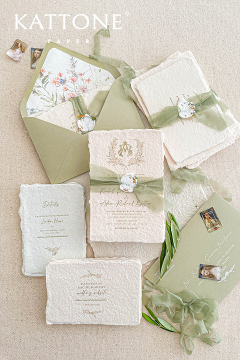 Soft, organic, and undeniably romantic - this colored handmade paper wedding invitation suite beautifully captures the essence of nature-inspired elegance. Printed on luxury blush-toned deckled-edge cotton paper, each piece is a work of art, blending timeless craftsmanship with delicate botanical elements and refined greenery details. At its heart lies a custom hand-drawn monogram, surrounded by soft watercolor foliage - a symbol of the couple’s unity and natural grace. 