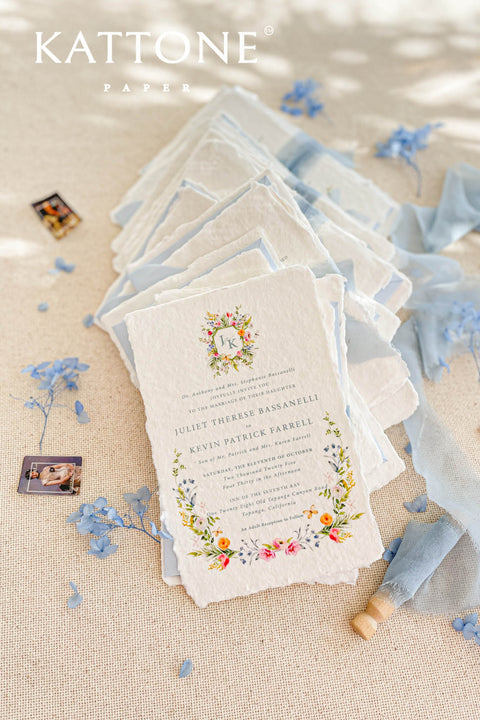This exquisite wedding invitation set offers a blend of timeless charm and personal artistry. Perfect for a summer wedding, each suite features a custom, hand-painted watercolor monogram with a delicate floral design. Printed on luxurious handmade paper, these floral invites offer a rich, tactile experience and a unique, romantic preview of your special day.