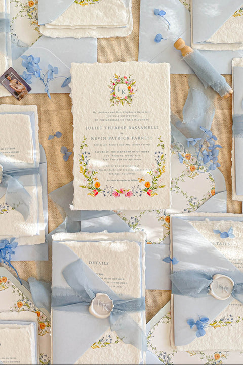 This exquisite wedding invitation set offers a blend of timeless charm and personal artistry. Perfect for a summer wedding, each suite features a custom, hand-painted watercolor monogram with a delicate floral design. Printed on luxurious handmade paper, these floral invites offer a rich, tactile experience and a unique, romantic preview of your special day.