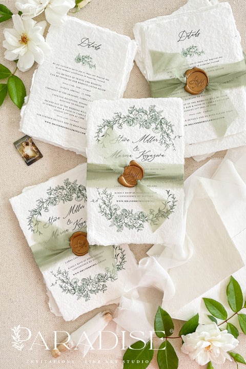 This exquisite wedding invitations suite offers a blend of natural elegance and romantic charm, perfect for a summer garden wedding. Each invite is printed on luxurious handmade cotton rag paper, providing a rich, tactile feel that beautifully complements the delicate botanical wedding stationery set design. The result is a truly romantic and sophisticated suite that beautifully hints at your special day.