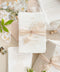 This exquisite wedding invitations suite offers a perfect blend of bohemian charm, natural texture, and elegant artistry. Each boho invites set is printed on luxurious handmade paper with a delicate deckle edge, providing a rich, tactile feel and a timeless finish. This fine art stationery is ideal for a relaxed yet sophisticated celebration, beautifully setting a warm and inviting tone for your guests.