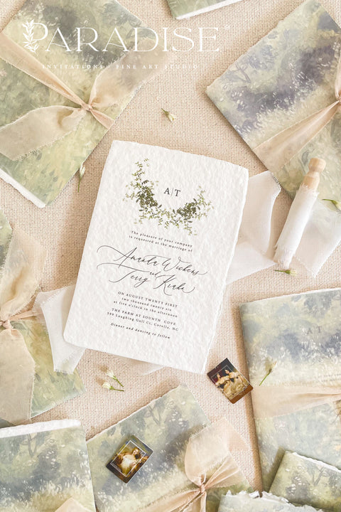 Announce your special day with timeless elegance through these handmade watercolor wreath wedding invitations — a perfect blend of artistry, romance, and personal touch. Each invitation features a delicately painted floral wreath, evoking natural beauty and heartfelt simplicity. Designed and assembled by hand, they set the tone for a wedding that’s both intimate and unforgettable.