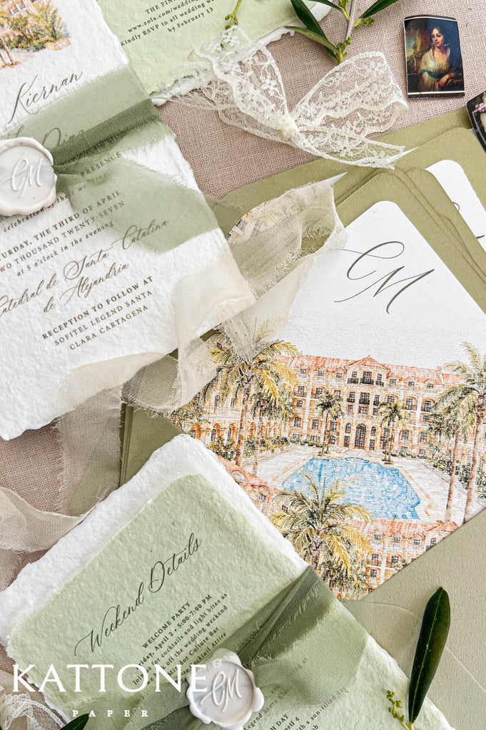 Close-up of an olive green wedding envelope with a custom watercolor liner illustrating a tropical resort, palm trees and blue swimming pool, alongside an ivory handmade wedding invitation and sage green weekend details card with silk ribbon.