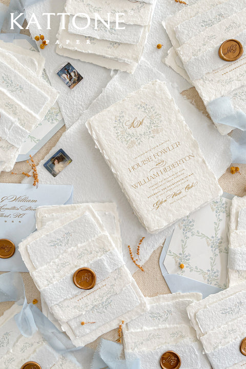 Embrace bohemian charm and natural elegance with the Alcina boho rustic stationery sets. Each handmade wedding invitation is a beautiful work of art, featuring luxurious cotton rag paper with a romantic deckle edge. To complete the bohemian feel, every suite is embellished with a delicate tassel, creating a uniquely personal and tactile experience for your guests. The combination of rustic textures and charming details makes this collection perfect for a relaxed and romantic celebration.