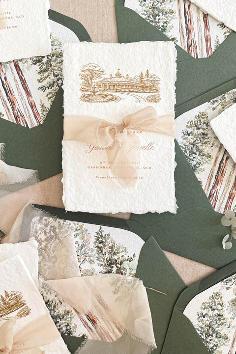 Handmade save the date cards with deckled edges, silk ribbon and venue illustration on cotton paper.