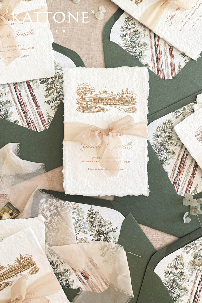 Handmade save the date cards with deckled edges, silk ribbon and venue illustration on cotton paper.