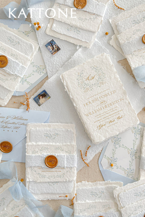 Embrace bohemian charm and natural elegance with the Alcina boho rustic stationery sets. Each handmade wedding invitation is a beautiful work of art, featuring luxurious cotton rag paper with a romantic deckle edge. To complete the bohemian feel, every suite is embellished with a delicate tassel, creating a uniquely personal and tactile experience for your guests. The combination of rustic textures and charming details makes this collection perfect for a relaxed and romantic celebration.