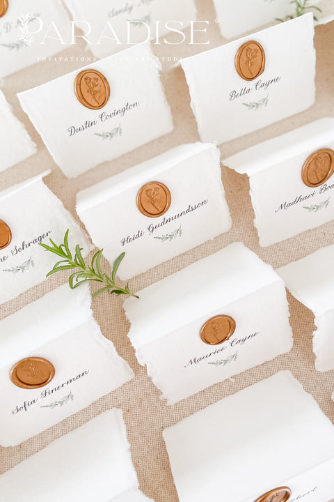 Elevate your wedding or event with our handmade paper place cards, crafted from luxurious cotton rag paper and finished with naturally torn deckled edges. Each card is adorned with a warm copper wax seal and elegant calligraphy, creating a timeless, fine-art detail that enhances any tablescape. Designed to bring organic texture, charm, and sophistication, these artisan place cards make your seating display unforgettable.