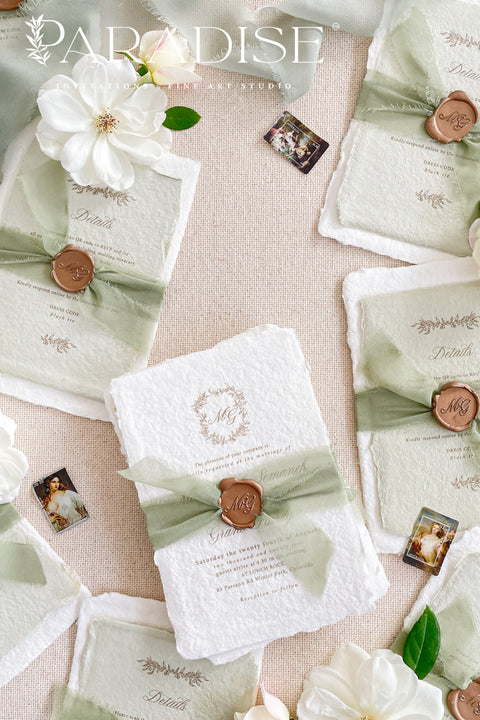 This exquisite wedding invitations suite offers a blend of natural elegance and modern romance. Perfect for a green summer wedding, these invitations are printed on luxurious handmade paper, which provides a rich, tactile feel. The elegant modern calligraphy design adds a touch of contemporary sophistication, setting a fresh and heartfelt tone for your special day.